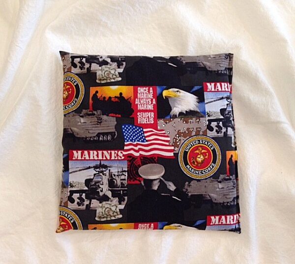 A Marine Corps Comfy Corn Bag with eagles, eagles, and marines on it.
