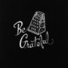 A black t-shirt with the product name "Be Grateful" on it.