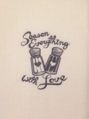 A "Season Everything With Love" Embroidered Flour Sack Towel that says season everything with love.