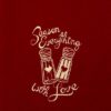 A red tee shirt with the words "Season Everything With Love" embroidered on it.