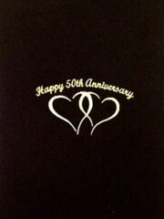 A black book with the product name "Happy 50th Anniversary" on it.