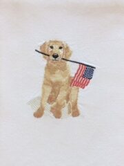 A white towel with the Patriotic Pup holding an american flag.