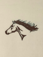 A horse head is embroidered on a piece of cloth.